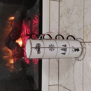 Four stacking mugs with wire rack.